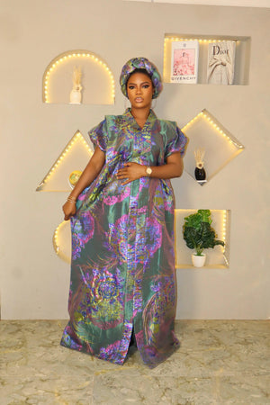 Woman in iridescent floral Brocade African boubou dress and matching headband, elegant indoor setting